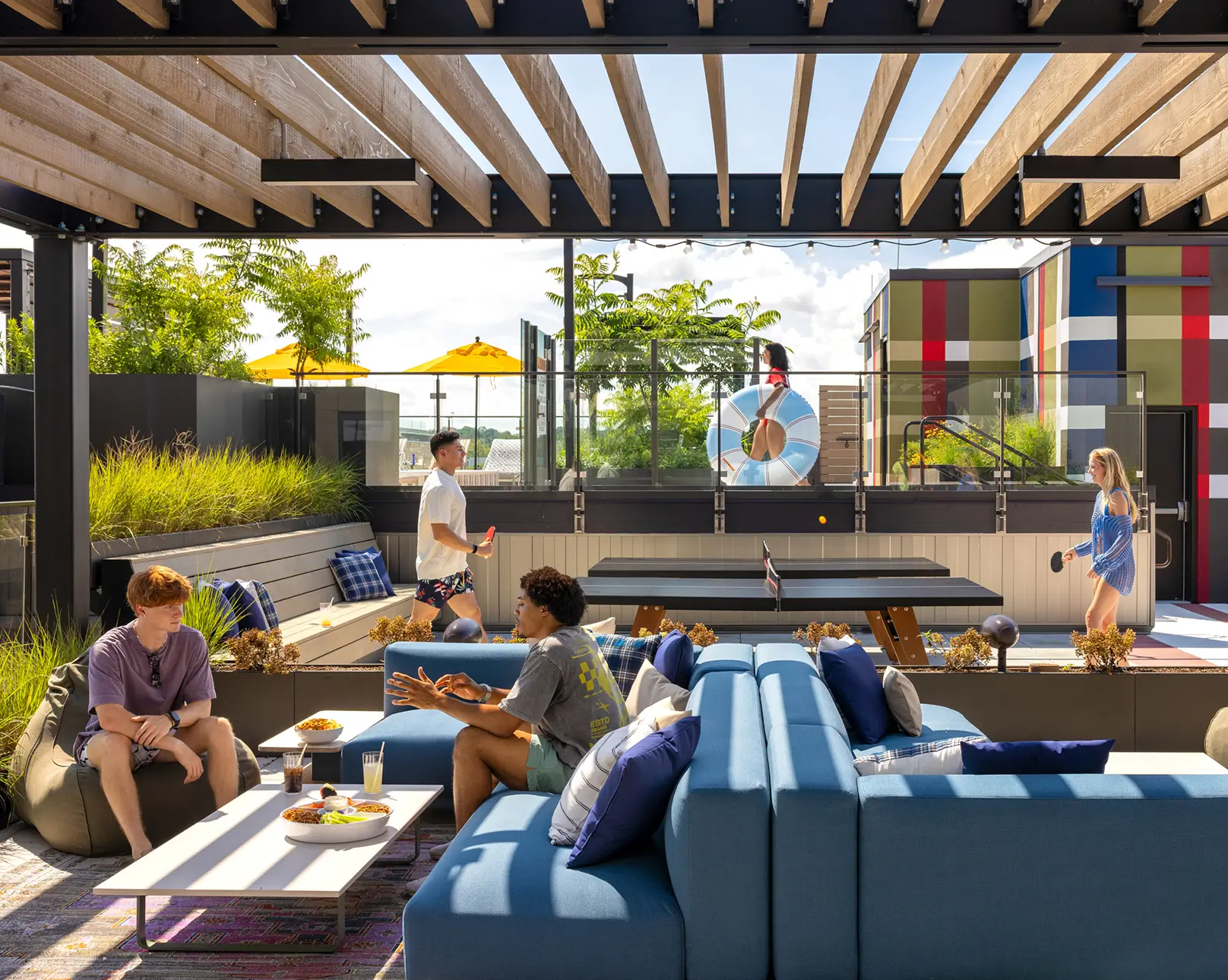 Outdoor area with ping pong tables and sofas