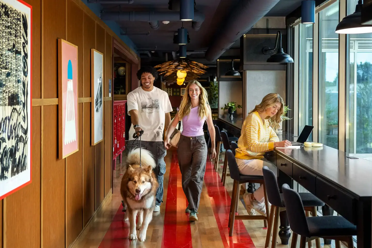 student residents walking a dog